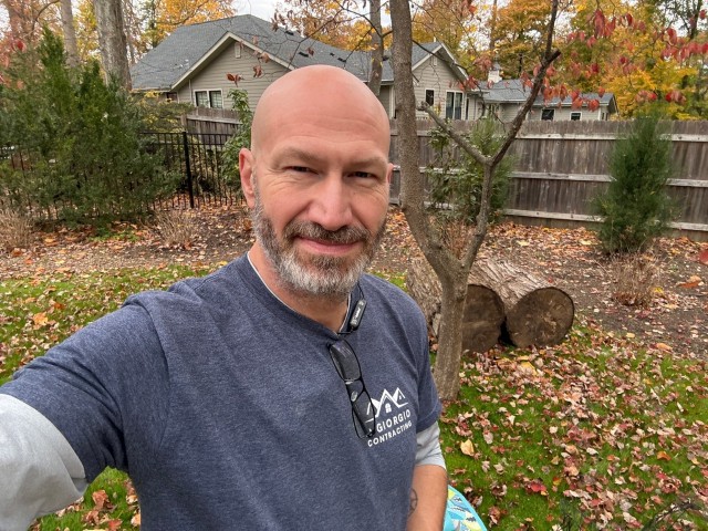 Paul DiGiorgio working in a yard